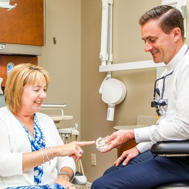 dentist talking with patient
